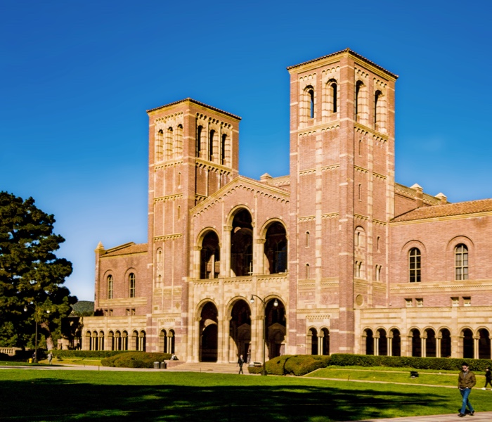 An large brick building with grass courtyard on a university campus representing the higher-education accounts payable market