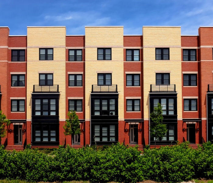 four-story apartment representing the property management industry