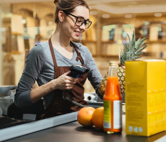 Female cashier in a retail or grocery store